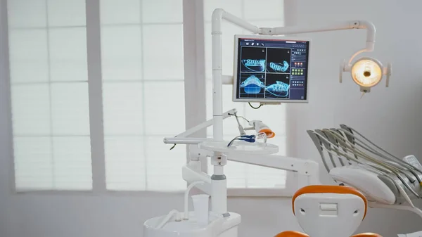 Empty stomatology orthodontic office with nobody in it revealing display with teeth diagnosis xray — Stock Photo, Image