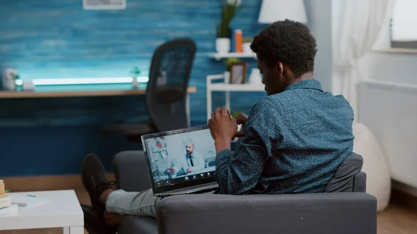 Selective focus on african american patient at home looking for medical help from doctor — Stock Photo, Image