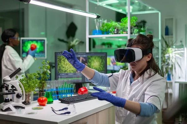 Scientist woman researcher wearing virtual reality headset