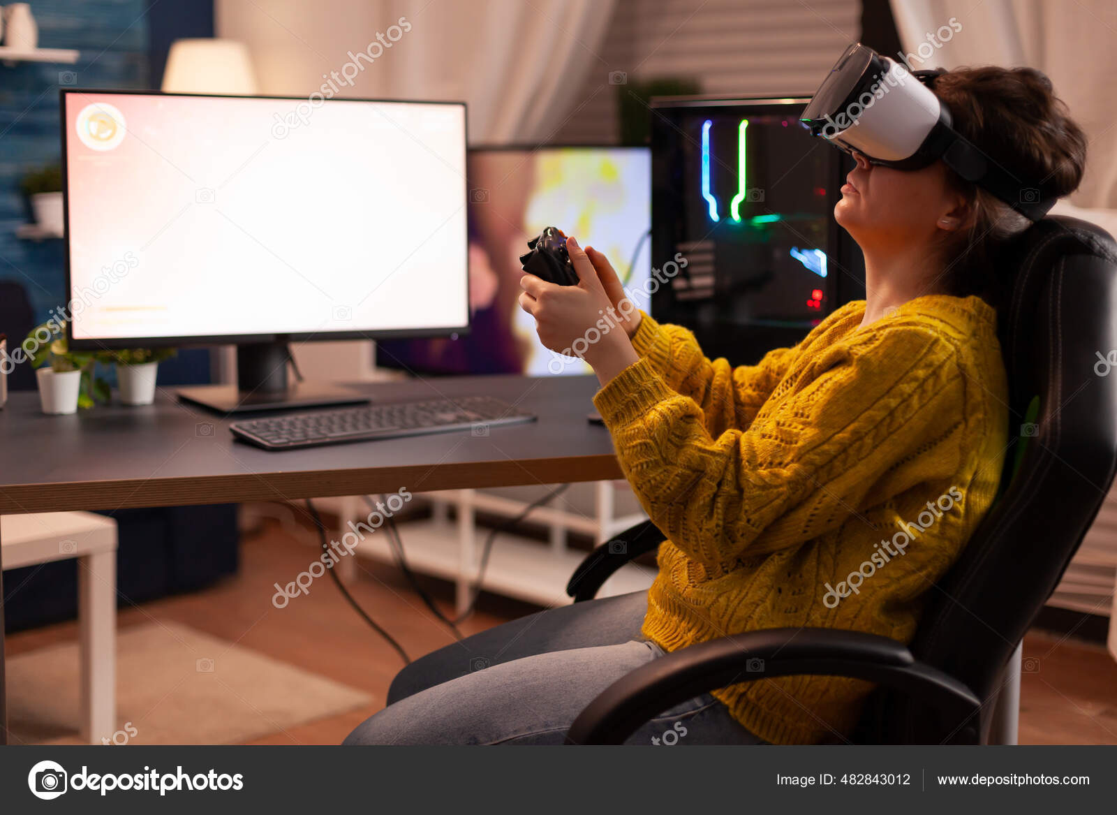 Woman esport cyber playing online game with virtual reality headset Stock Photo by ©DragosCondreaW 482843012