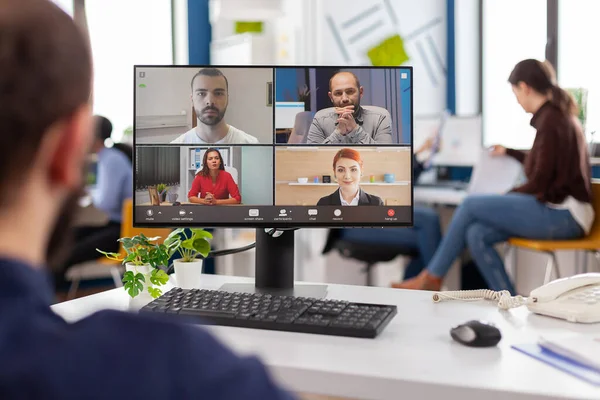 Paralyzed handicapped businessman sitting immobilized in wheelchair having videomeeting — Stock Photo, Image