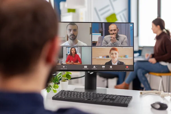 Paralyzed handicapped businessman sitting immobilized in wheelchair having videomeeting — Stock Photo, Image