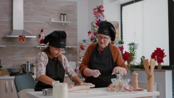 Traditional grandparents preparing homemade cookies dessert celebrating christmas holidays — Stock Video