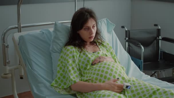 Portrait of pregnant adult holding hand on belly — Stock Video