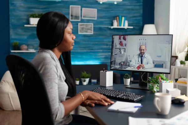 African american woman discussing sickness respiratory symptoms with virtual physician doctor — Photo
