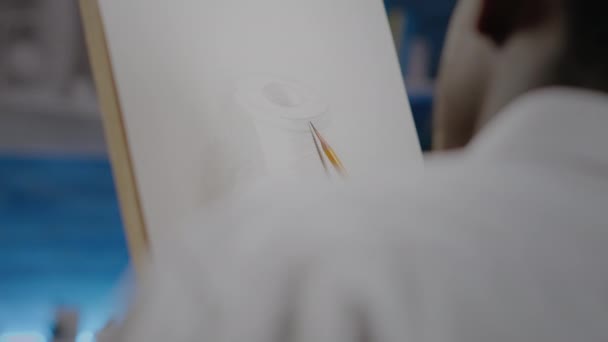 Close up of african ethnicity person drawing vase with pencil — Stock Video