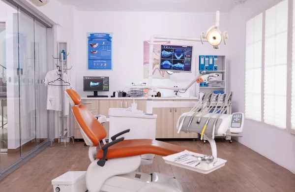 Interior of empty professional modern stomatology hospital office ready for dental tooth surgery