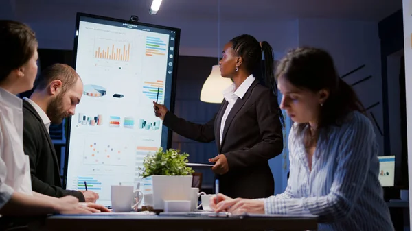 stock image Overworked businesswoman with dark skin brainstorming financial strategy