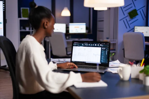 Overworked architect analyzing blueprint engineering project plan — Stock Photo, Image