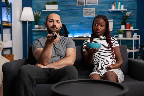 POV of interracial couple watching television and relaxing — Stock Photo, Image