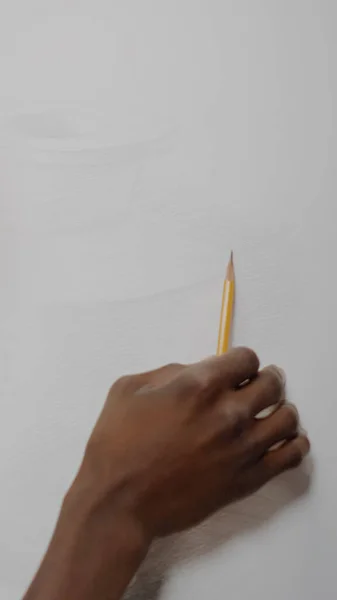 African american artist creating drawing of vase with pencil — Stock Photo, Image