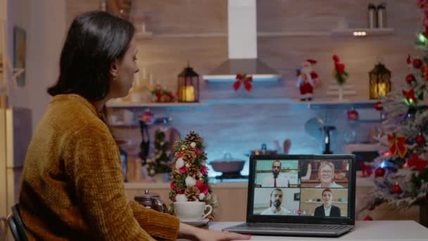 Woman using video call for work meeting on christmas eve — Stock Video