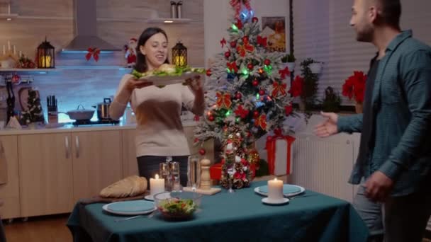 Woman preparing christmas dinner for celebration — Stock Video