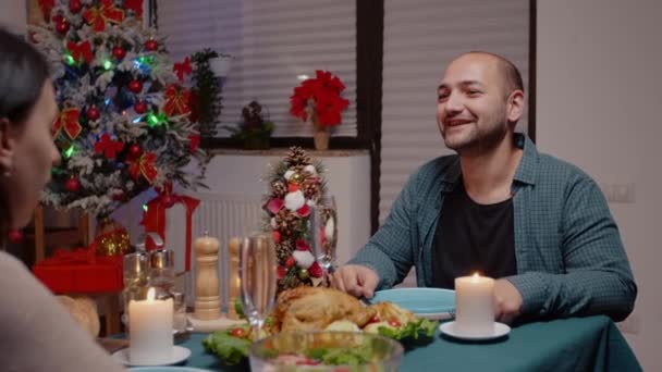 Close up of man enjoying festive dinner and clking glasses — стоковое видео