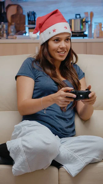 Woman playing video games on console with controller — Stock Photo, Image