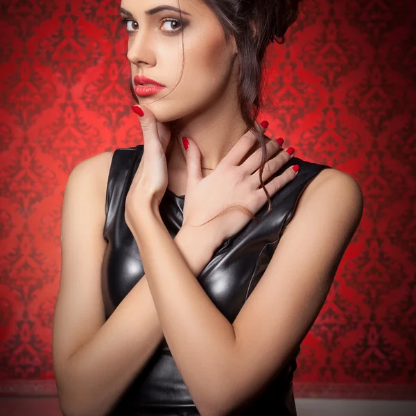 Sensual woman in red vintage interior — Stock Photo, Image