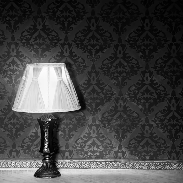 Vintage lamp on a retro fireplace toned image — Stock Photo, Image