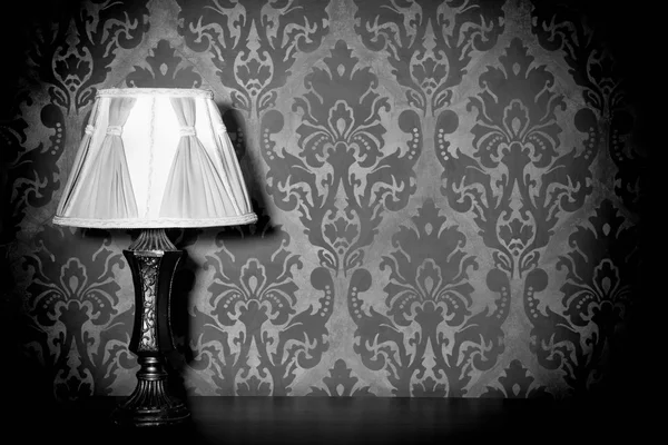 Vintage lamp on blue rococo pattern background — Stock Photo, Image