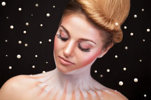 Woman surrounded by pearls in surrealistic concept — Stock Photo, Image