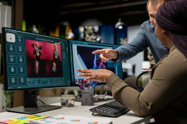 Diverse photo editing team generating AI content and retouching pictures, working on their creative portfolio with text to image program and futuristic software. Advanced editors.