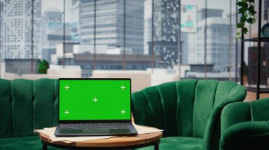 Empty modern luxurious office showcasing isolated display on laptop, high end workspace equipped with professional gadgets and networking system. Career development and motivation.