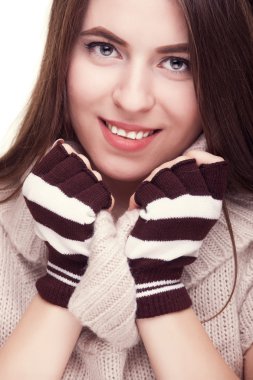 Pretty girl smiling with fingereless gloves on hand clipart