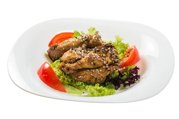 chicken in teriyaki sauce served with salad isolated on white background