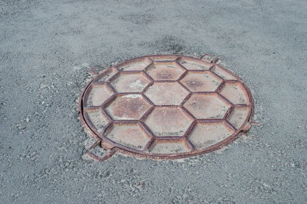 Manhole in the pavement — Stock Photo, Image