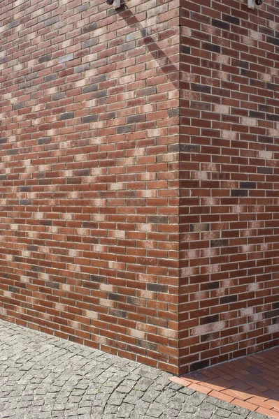Corner of the house lined with brick and stone — Stock Photo, Image