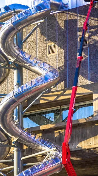 Repair Work Using Crane on metal spiral pipe for fire brigade downhill.  London. UK — Stock Photo, Image