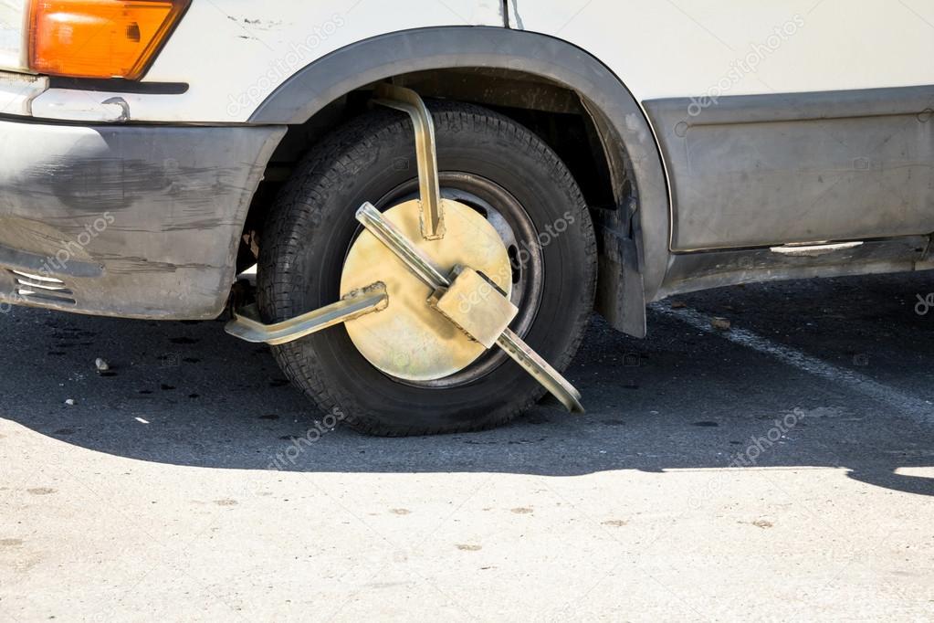 Police anti-theft device on car wheel