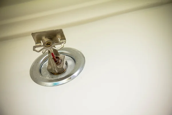 Old sprinkler system on the wall of hotel — Stock Photo, Image