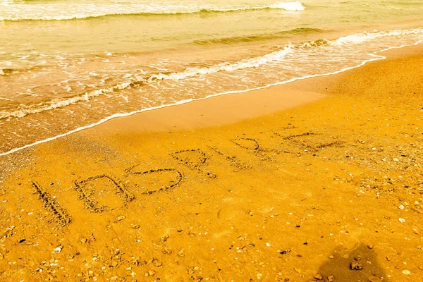 Inspira. Concepto de motivación creativa escrito en la arena de la playa . —  Fotos de Stock