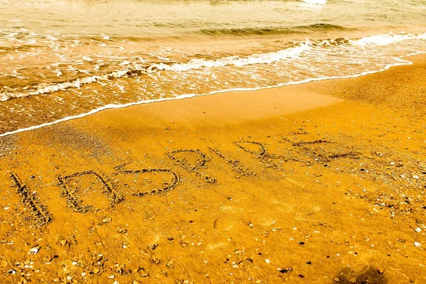Inspira. Concepto de motivación creativa escrito en la arena de la playa . —  Fotos de Stock