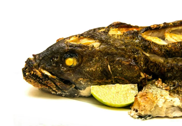 Grouper baked in the oven at the banquet table — Stock Photo, Image