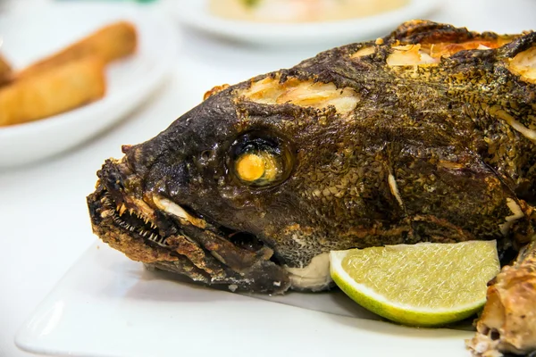 Grouper baked in the oven at the banquet table — Stock Photo, Image