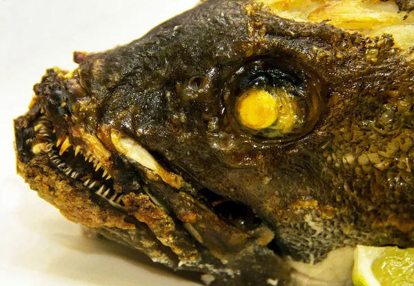 Grouper baked in the oven at the banquet table — Stock Photo, Image