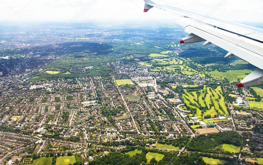 Big airplane  begins to decline and prepares for landing in Heathrow Airport . London. UK