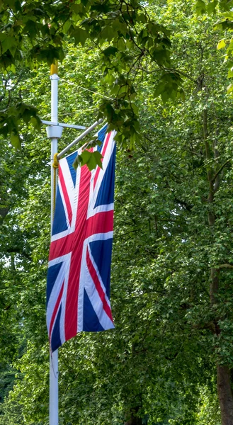 The Union Jack Flag flying from a flag pole on The Mall street. London.  England.  UK.  Taken in June 2015 — Stock Photo, Image