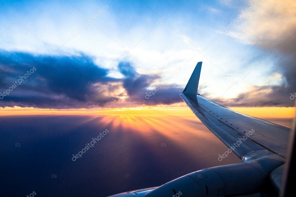 Wing aircraft at sunset. Looking Out Through Airplane Window