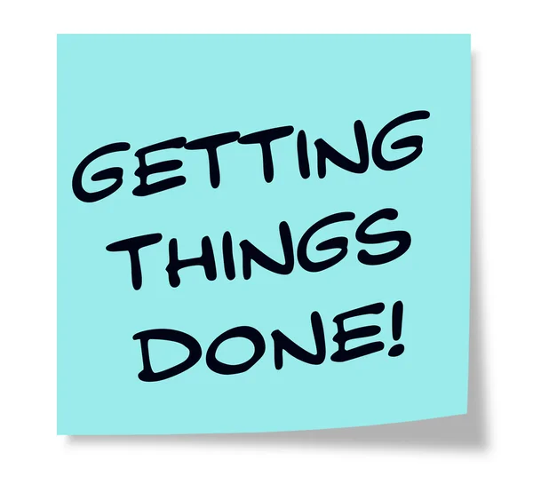 Getting Things Done written on a blue sticky note — Zdjęcie stockowe