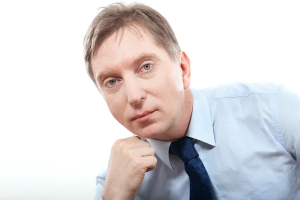 Friendly businessman in tie against neutral background — Stock Photo, Image