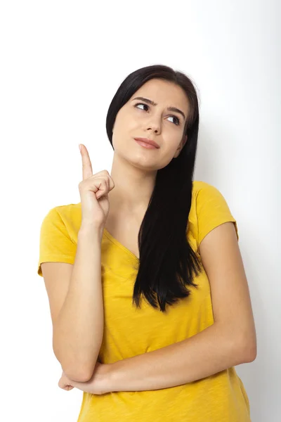 Girl pointing at. Young beautiful woman showing on empty space. — Stock Photo, Image