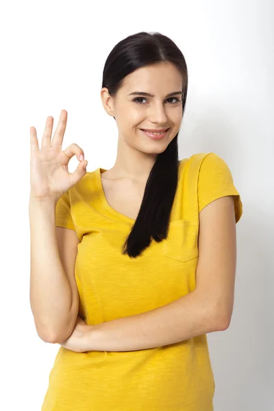 Happy young woman shows sign okay. Success. Isolated — Stock Photo, Image