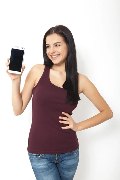 Hand van de vrouw met de witte smartphone. — Stockfoto