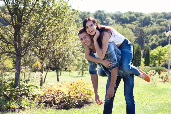 Portrait of happy young couple looking at each other. — Stock Photo, Image