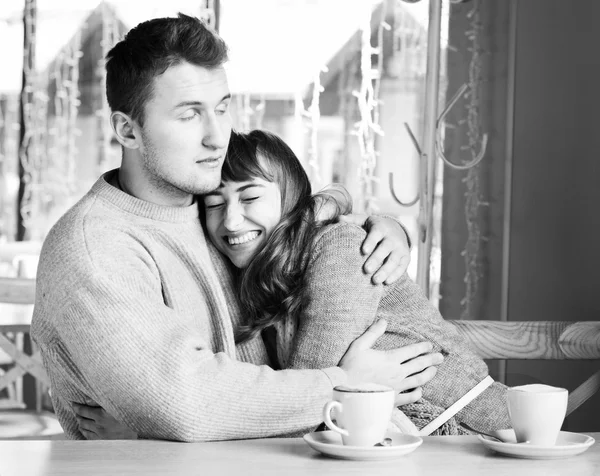 Young people sitting in the cafe and eating dessert. black and white — Stock Photo, Image