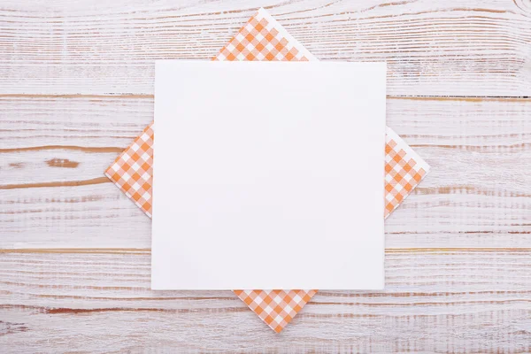 Paper napkin on old wooden table. place for text — Stock Photo, Image