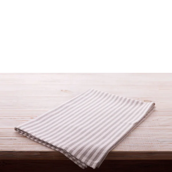 ナプキン。分離された白の木製テーブルに布ナプキン。視点、モックアップ. — ストック写真