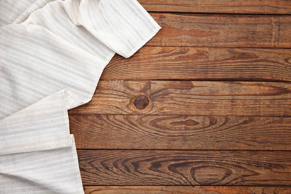 Empty canvas napkin on wooden desk top view — Stock Photo, Image